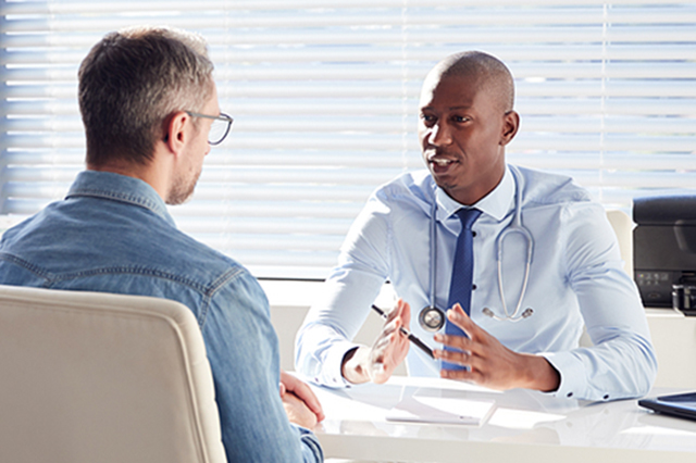 Gp talking with a patient