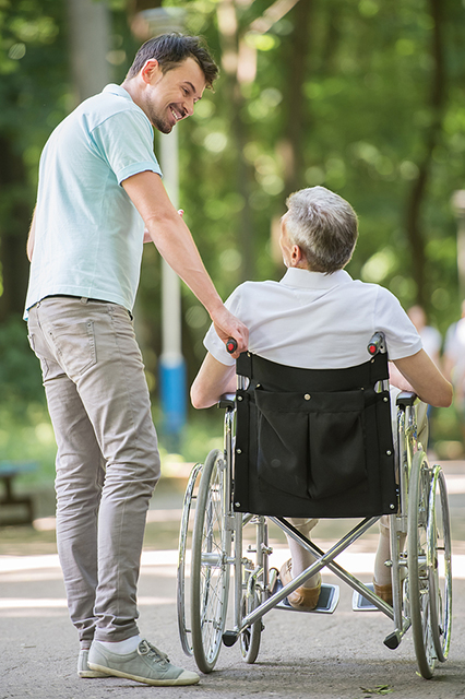 carer with patient in a whellechair