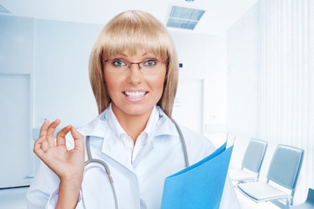 Image of smiling  nurse with blue folder